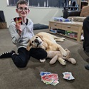 Animals at Home - Photography Competition Spot Prize Winner: Mason (7). Judges feedback: Love the humour in this image. It is like the dog is reading the cards and fully part of the game.